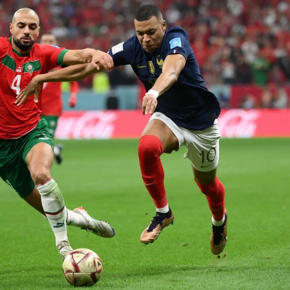 Morocco's midfielder #04 Sofyan Amrabat fights for the ball with France's forward #10 Kylian Mbappe during the Qatar 2022 World Cup semi-final football match between France and Morocco at the Al-Bayt Stadium in Al Khor, north of Doha on December 14, 2022. (Photo by FRANCK FIFE / AFP)